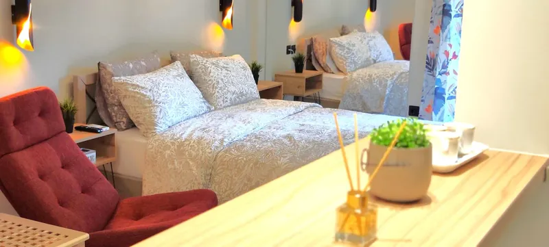 The red armchair beside the bed